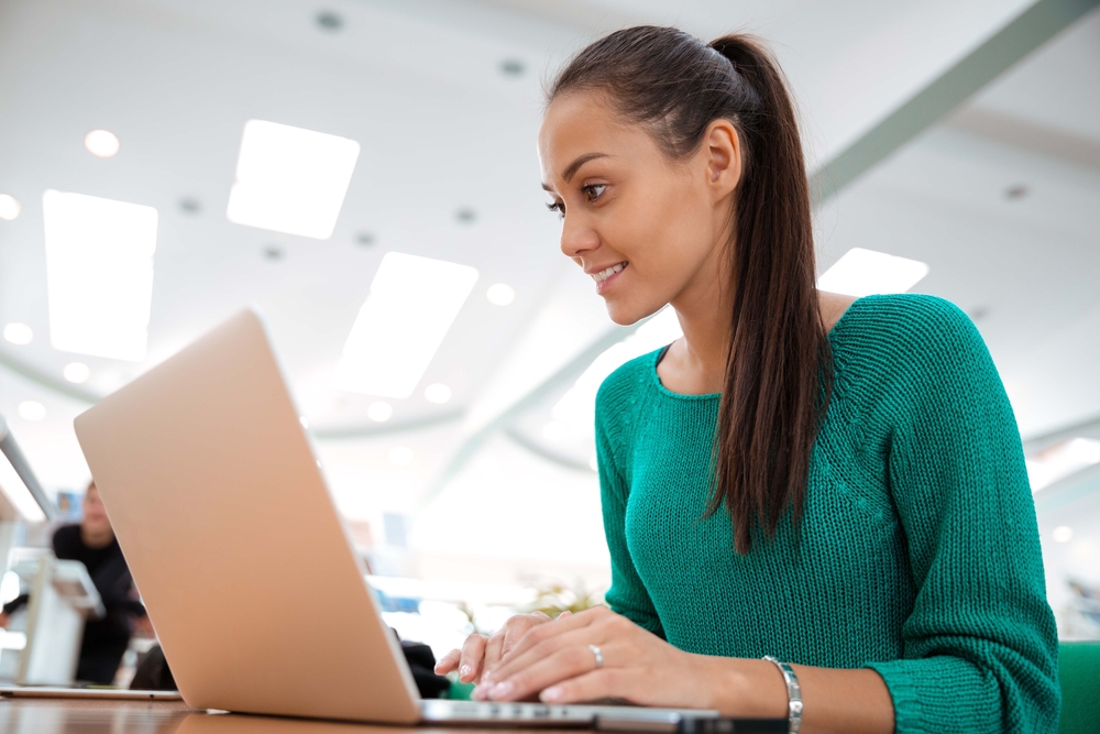 Adult learner working on a laptop.