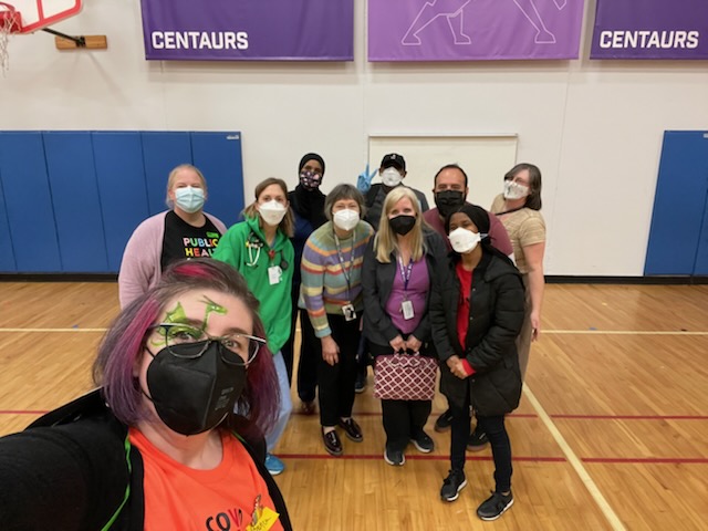 A group of Metro ECSU staff and volunteers at a COVID-19 vaccine clinic.