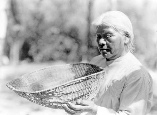 Southern Miwak with a basket by Edward S. Curtis, 1924.