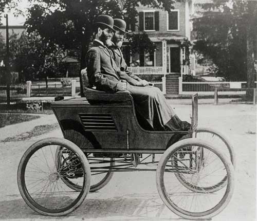 F.O. and F.E Stanley sitting in one of their inventions
