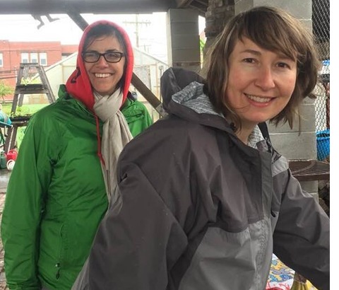 Liz (in gray) at our 2018 plant sale! Board Chair Vita in green. 