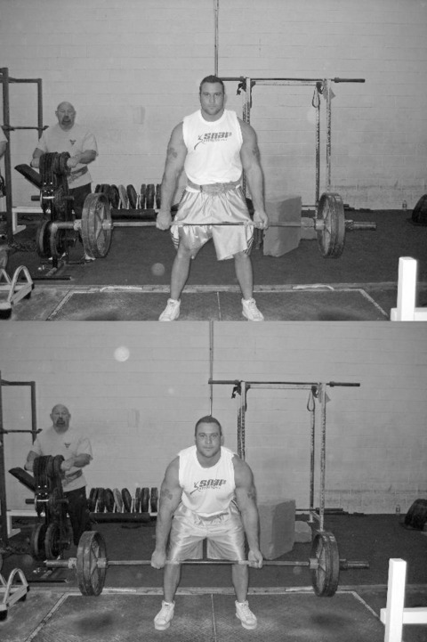 Louie Simmons watches Greg Panora do Dimel deadlifts