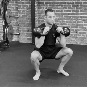 Tony Gracia performing the double kettlebell front squat