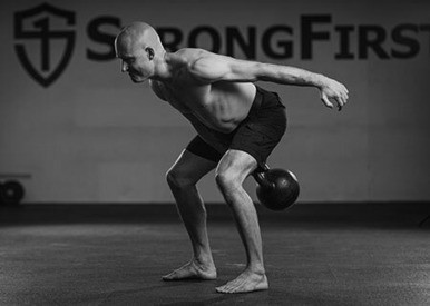 Pavel “Sinister” Macek showing the one-arm kettlebell swing