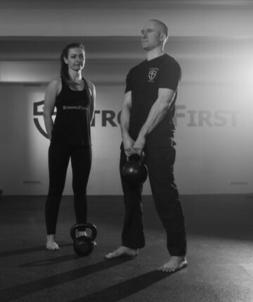 Pavel and Justyna teaching the kettlebell deadlift