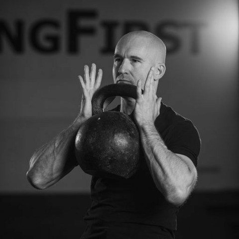 Pavel Macek shows how holding a heavy kettlebell to perform goblet squats