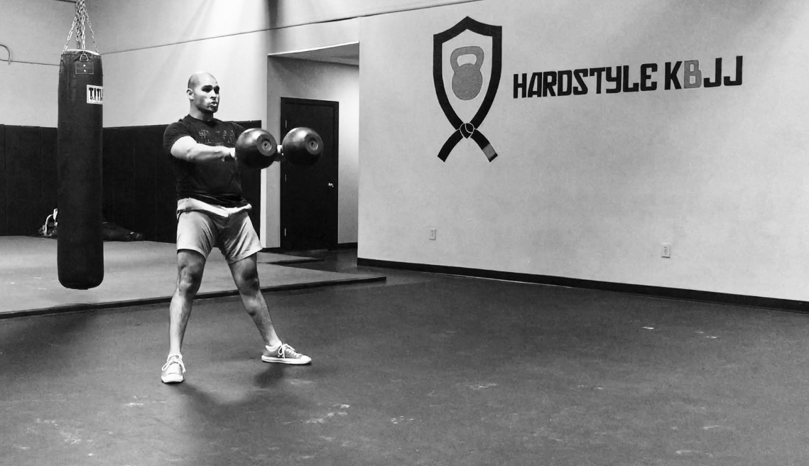 Andżelika Stefańska showing the double kettlebell front squat