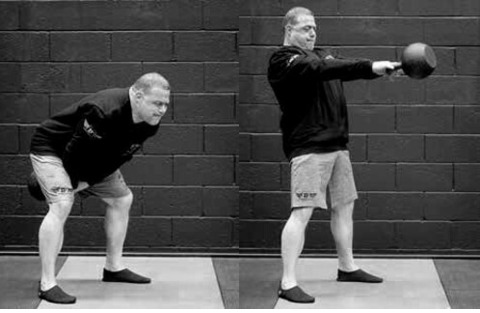 Andy Bolton performing the two-arm kettlebell swing