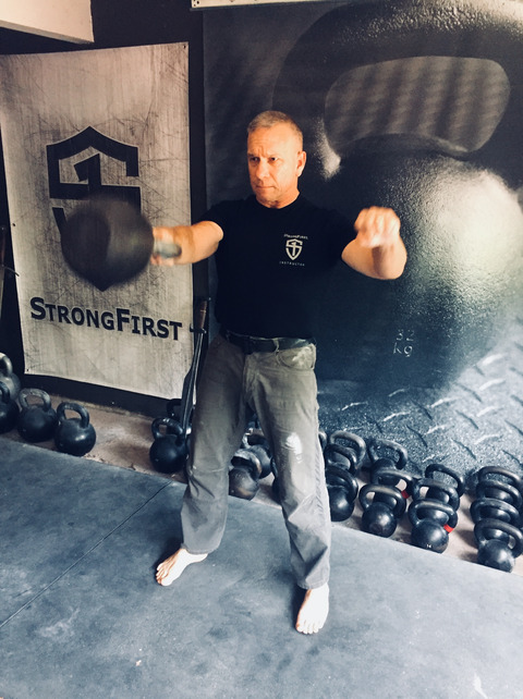 Rif performing the one-arm kettlebell swing