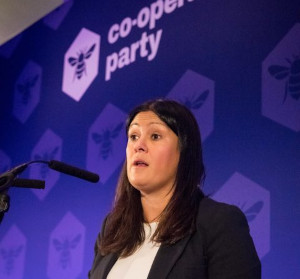 A photo of Lisa Nandy standing in front of a Co-operative Party backdrop