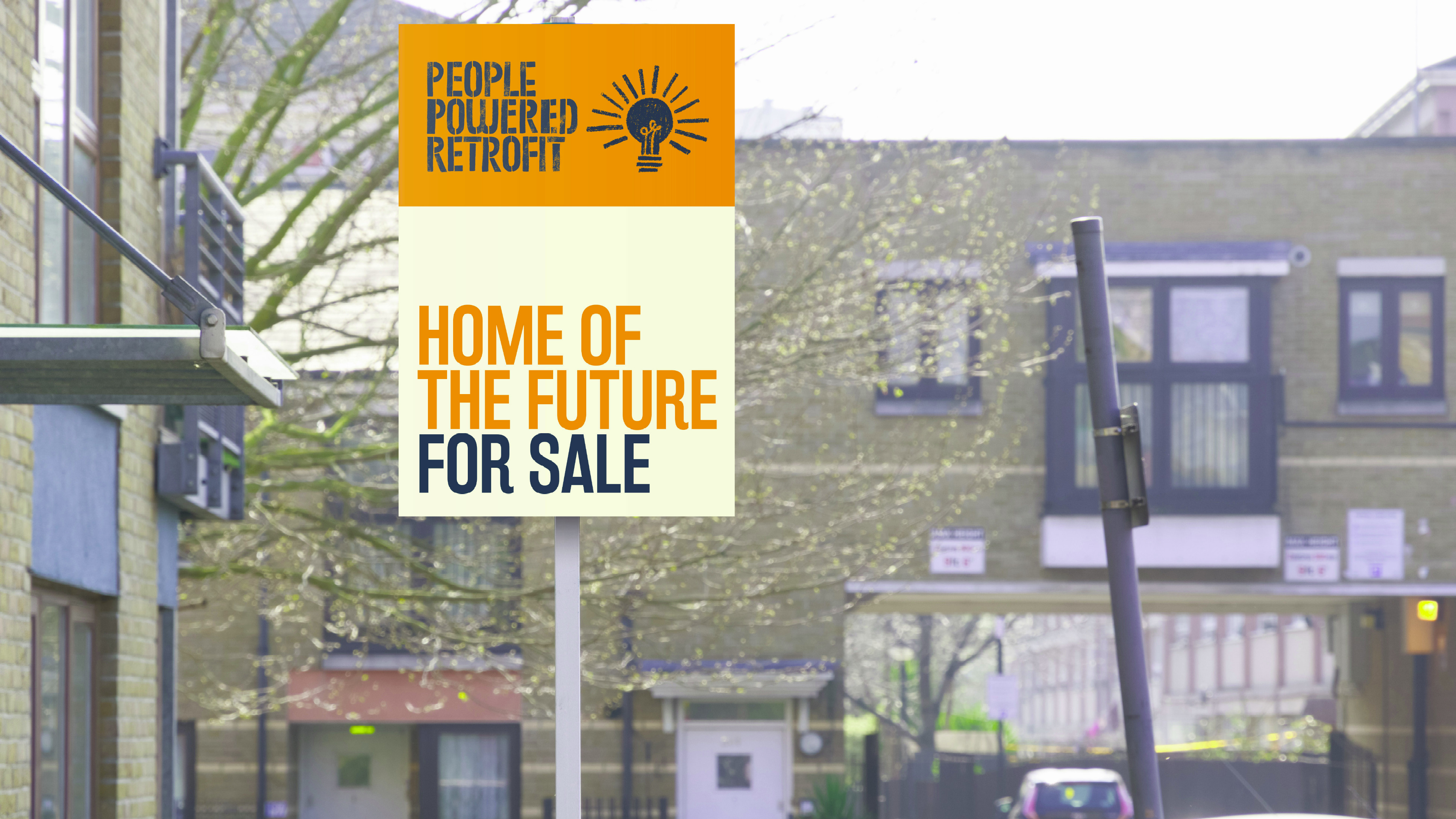 Photo of a sign saying “People Powered Retrofit - Home of the Future For Sale“