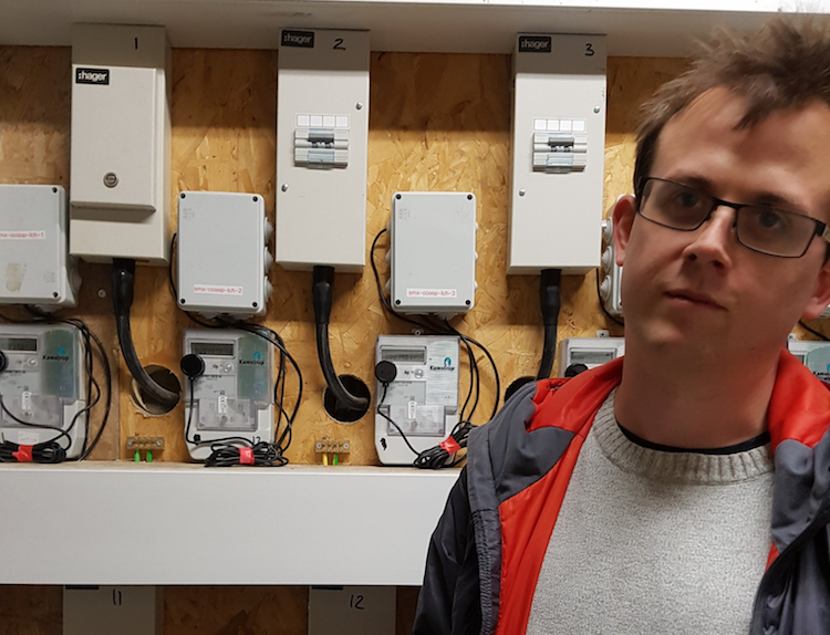 photo of ben in front of electricity meters