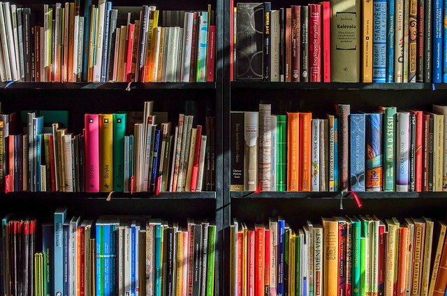 A photo of bookshelf full of colourful books