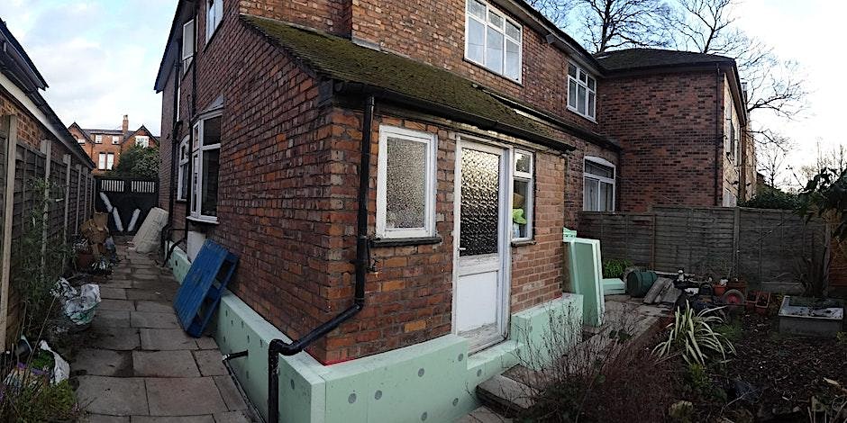 A photo of the outside of a semi detached house with partially fitted external wall insulation.