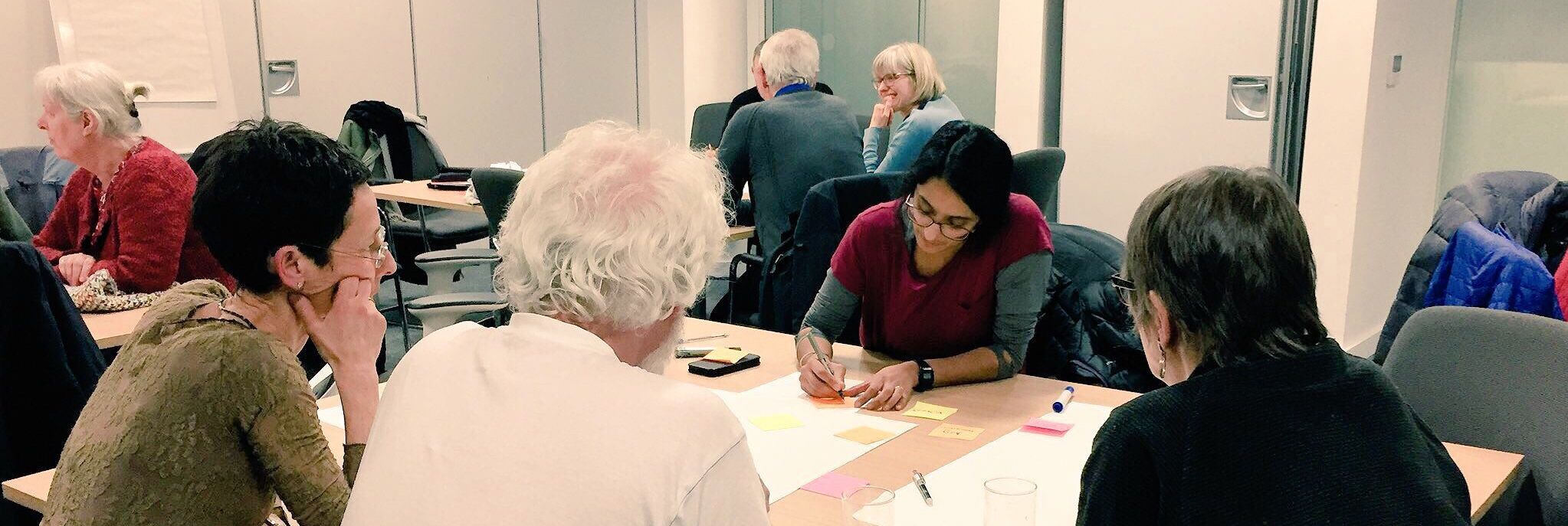 Carbon Co-op staff working with members in retrofit workshop