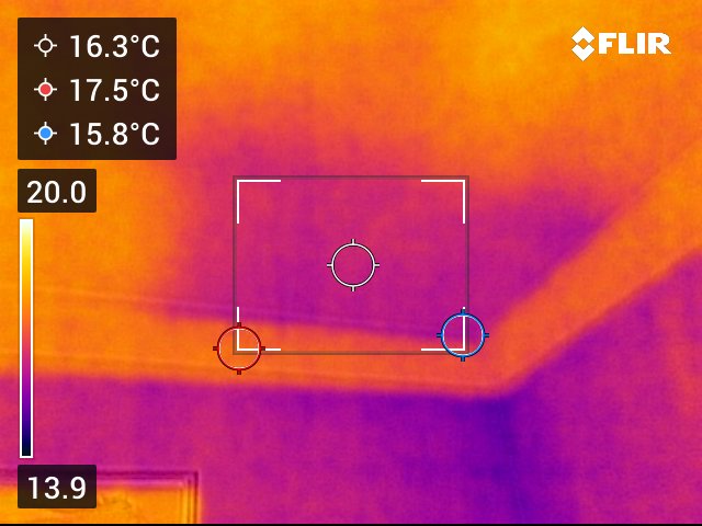 A photo of a ceiling with a thermal imaging device