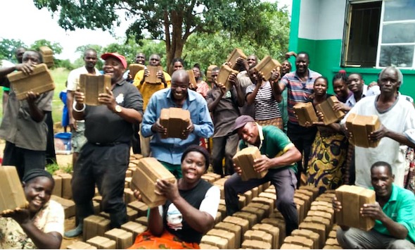 group holding bricks