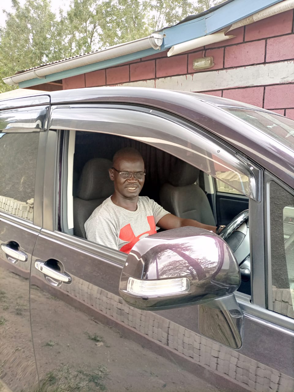 Eric driving Toyota Noah minivan