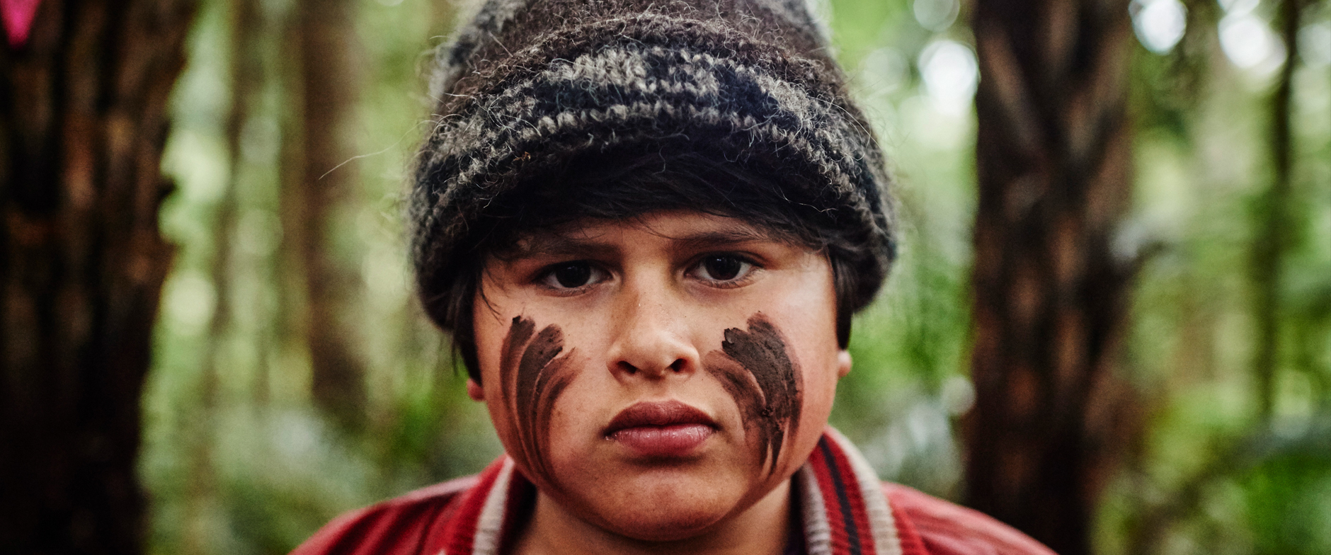 young man with camo face paint