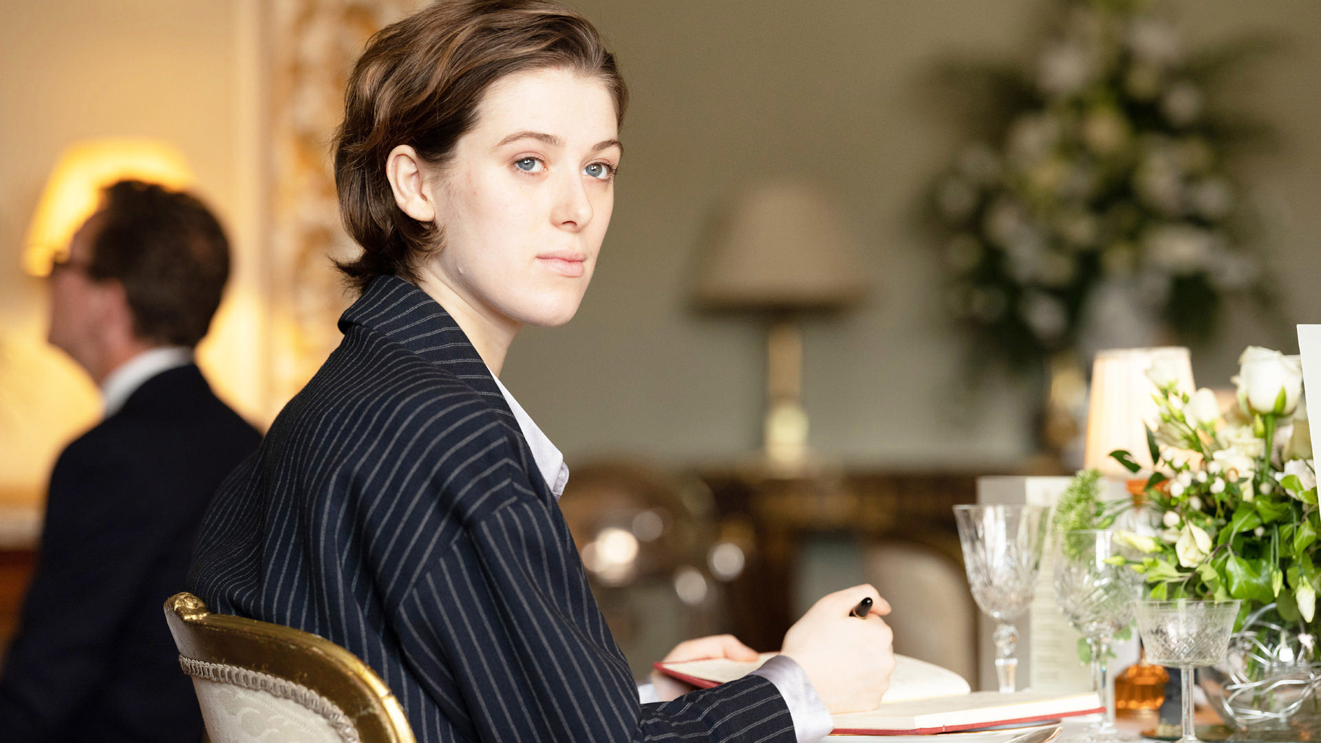 woman sitting at a table in a nice restaurant