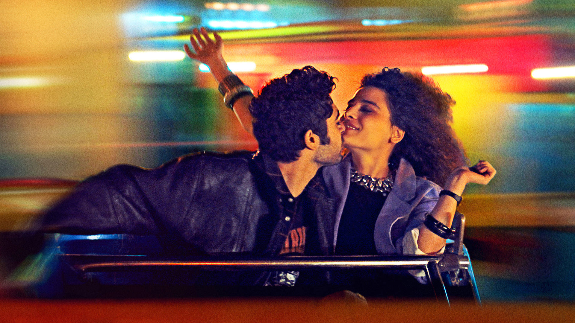 happy couple on a fairground ride