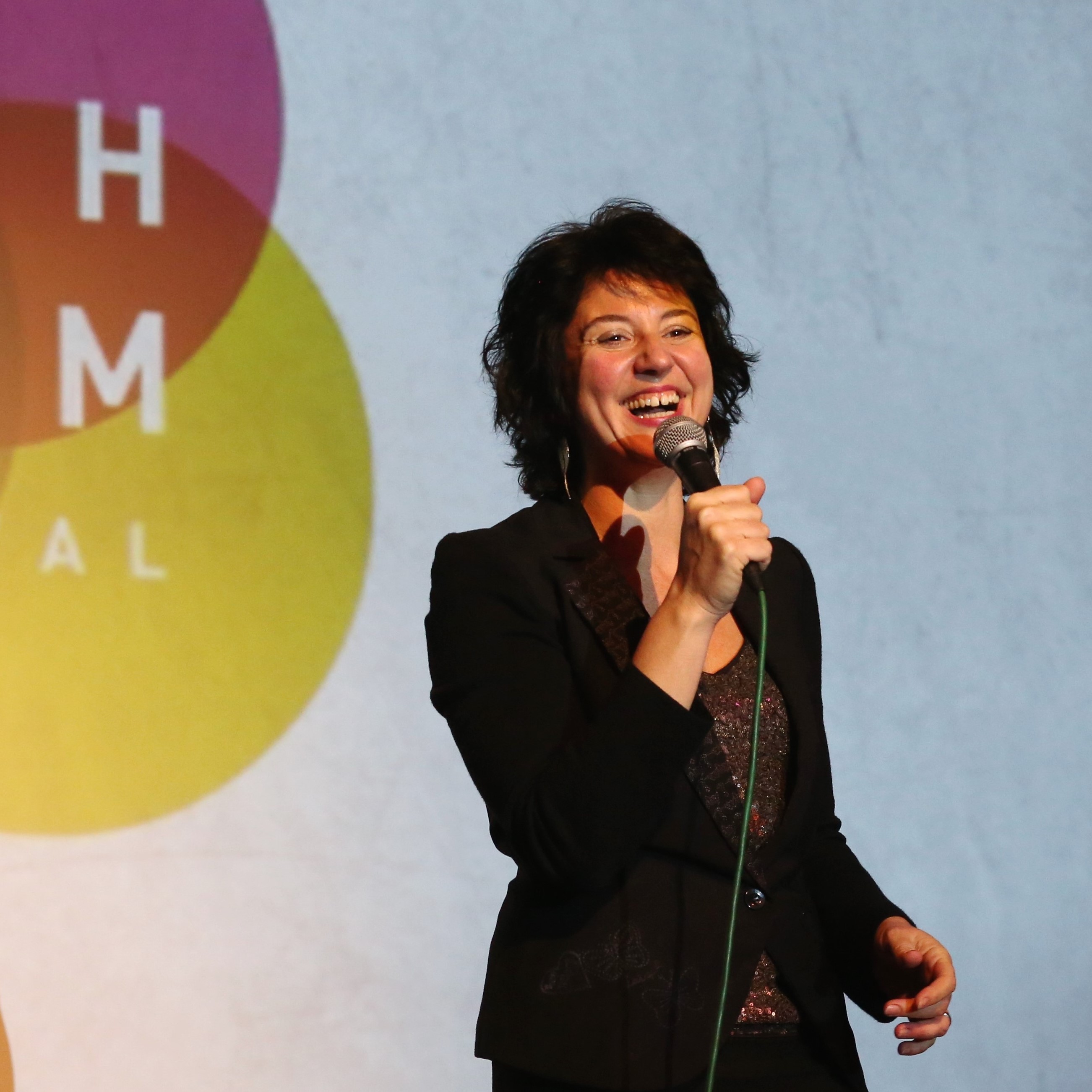 Woman with a microphone on stage