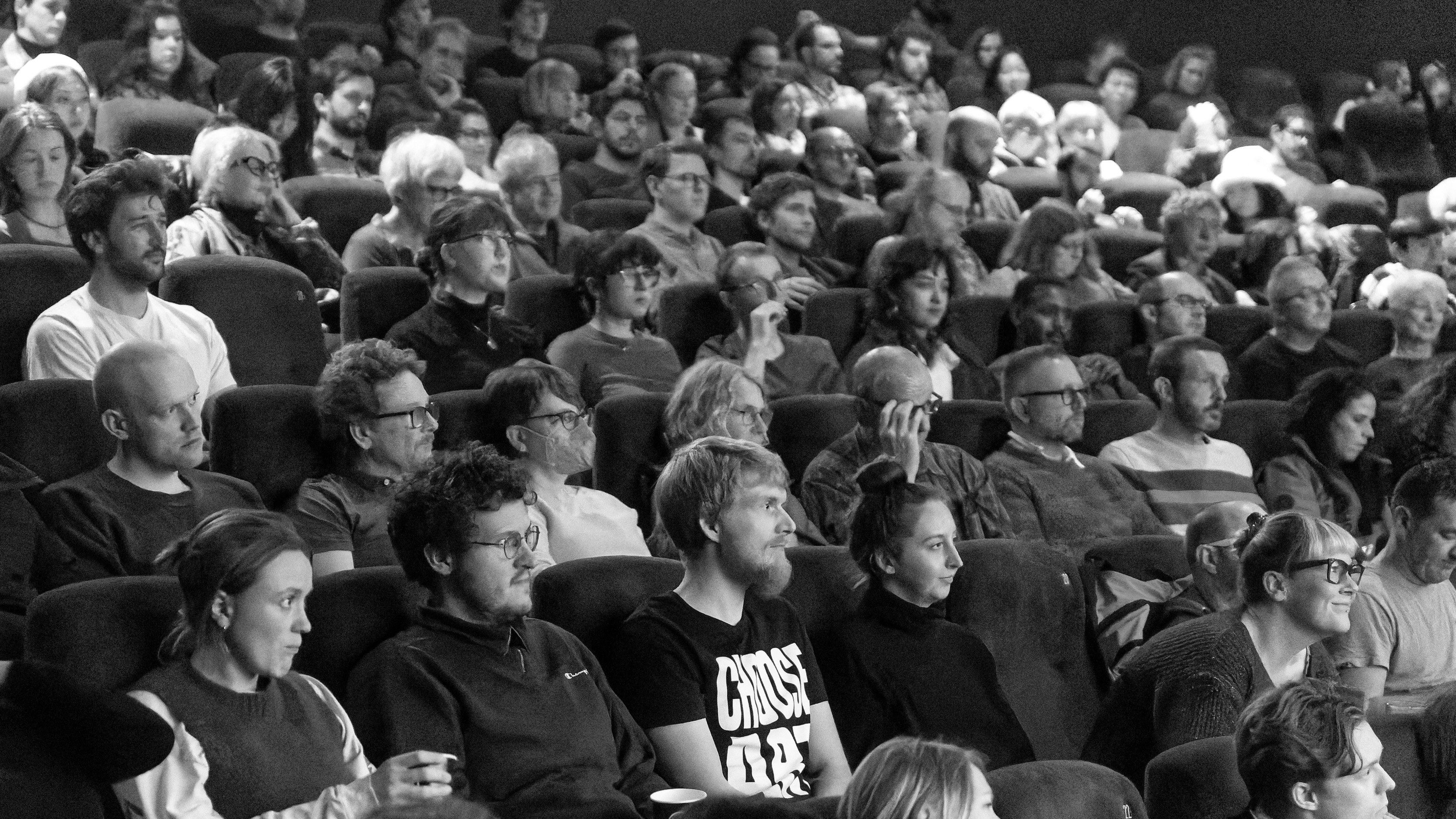 grayscale image of a film festival audience