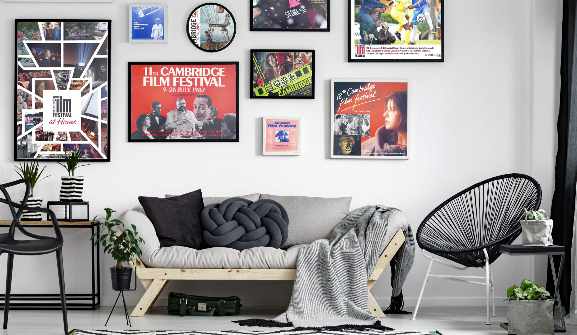 modern room with various cambridge film festival posters framed on the wall