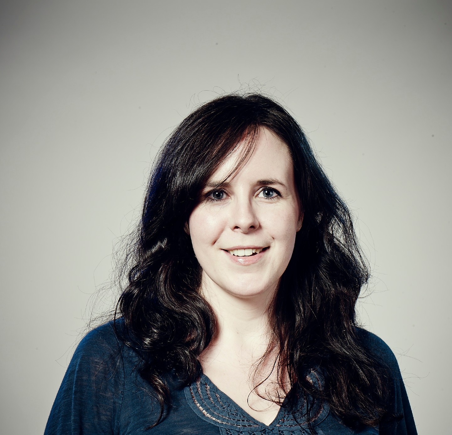 headshot of a woman looking at the camera