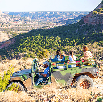 A group of people taking a Jeep tour through Palo Duro Canyon.